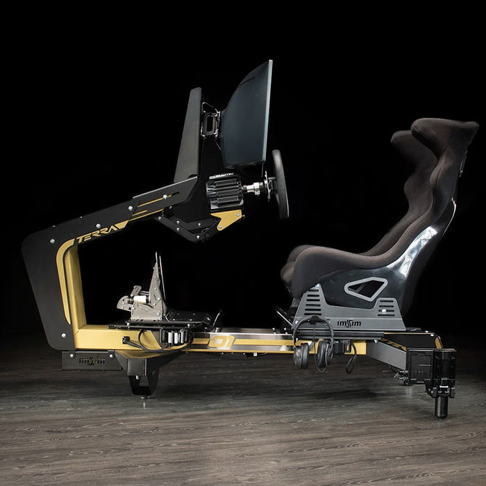 Side profile of the ImSim TERRA racing simulator in black and gold with ergonomic racing seat, steering wheel mount and pedal platform.
