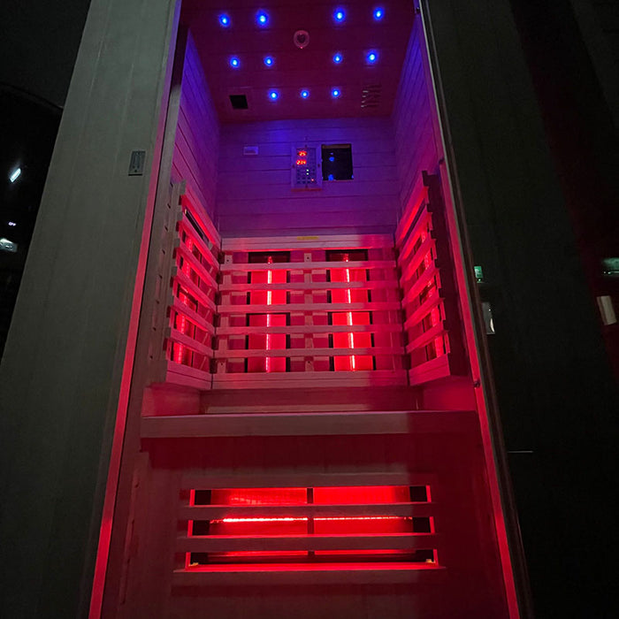 Front view of the Insignia KY002 Infrared Sauna, featuring LED lighting and a spacious design that fits seamlessly into any home.