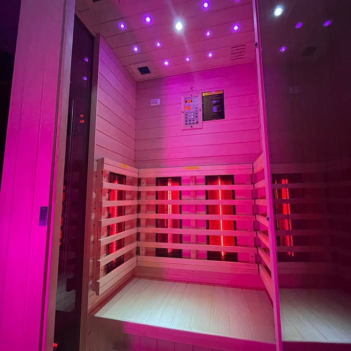 Insignia KY002 Infrared Sauna 1000 x 900 interior illuminated with a blend of pink and red lighting, creating a soothing sauna environment.