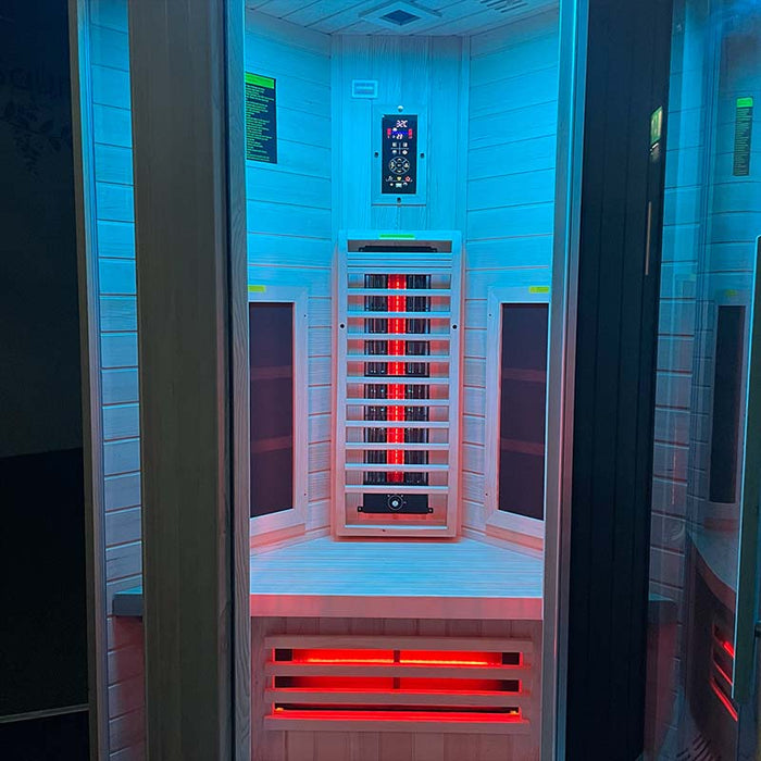 Entrance view of the Insignia KY003 Infrared Indoor Sauna 1000 x 1000mm illuminated by blue LED chromotherapy lighting, enhancing the spa-like ambiance.