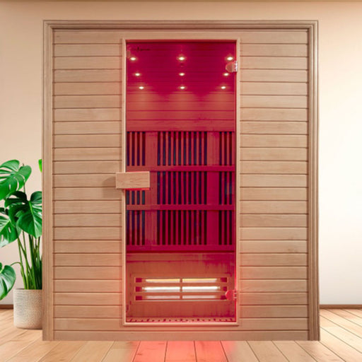 Front-facing view of the Insignia KY009 Infrared Indoor Sauna 1500 x 1000 in a contemporary interior with potted greenery and wooden flooring for a serene wellness vibe.