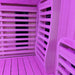 Interior of the Insignia KY2216 Sauna bathed in purple chromotherapy lighting, designed to enhance mood and relaxation during each session.