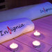 Close-up of Insignia-branded towels and lit candles inside the KY2216 Infrared Sauna, creating a spa-like, relaxing atmosphere.