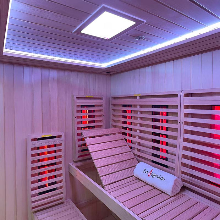 Inside the Insignia KY2216 Sauna showing ergonomic backrests, adjustable bench loungers, and the strategic placement of infrared heaters for an immersive experience.