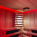 A detailed view of the wooden wall lamp in the Insignia Outdoor Hybrid Infrared Sauna 1700 x 1500mm, surrounded by warm red LED Chromotherapy lighting for a calming, atmospheric effect.