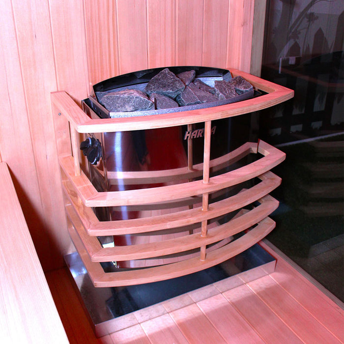 The Harvia stove inside the Insignia Outdoor Hybrid Infrared Sauna 2000 x 2000mm, showcasing traditional sauna stones and a sleek wooden guard for safety.