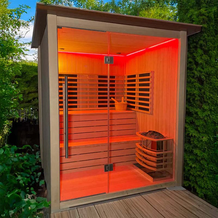 The Insignia Outdoor Hybrid Infrared Sauna 2000 x 2000mm in a modern patio setting, featuring tempered glass doors and LED Chromotherapy lighting.