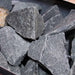 Close-up of traditional sauna stones used with the Harvia stove in the Insignia Outdoor Hybrid Infrared Sauna 2000 x 2000mm for optimal heat retention.