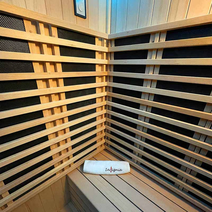 The premium Canadian Hemlock wood seating and infrared heater panels inside the Insignia Outdoor Infrared Sauna 1500 x 1300mm, offering a cosy, luxurious space for relaxation.