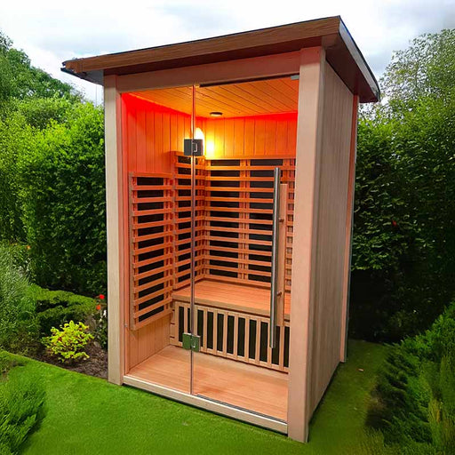 The Insignia Outdoor Infrared Sauna nestled in lush greenery, highlighting its natural Canadian Hemlock wood and contemporary design.