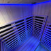 The calming blue chromotherapy LED lighting inside the Insignia Outdoor Infrared Sauna 1500 x 1300mm, enhancing the relaxation experience.