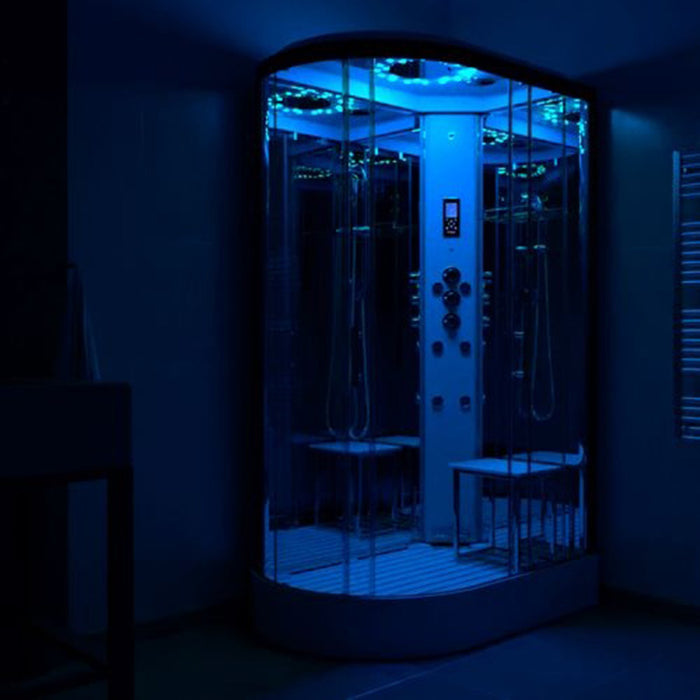 Insignia Platinum 1100 x 700 RH Steam Shower glowing with deep blue chromotherapy lighting for relaxing night-time sessions.