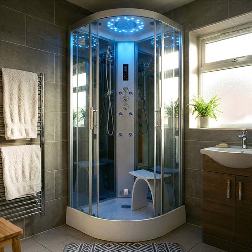 Insignia Platinum Quadrant Steam Shower 1000 x 1000 in a contemporary bathroom, with illuminated rainfall shower, massage jets, glass enclosure and shower seat.