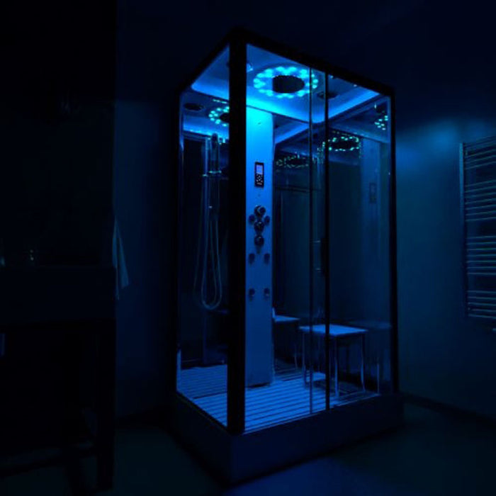 Insignia Platinum Rectangle Steam Cabin with glowing blue chromotherapy lights enhancing your wellness environment.