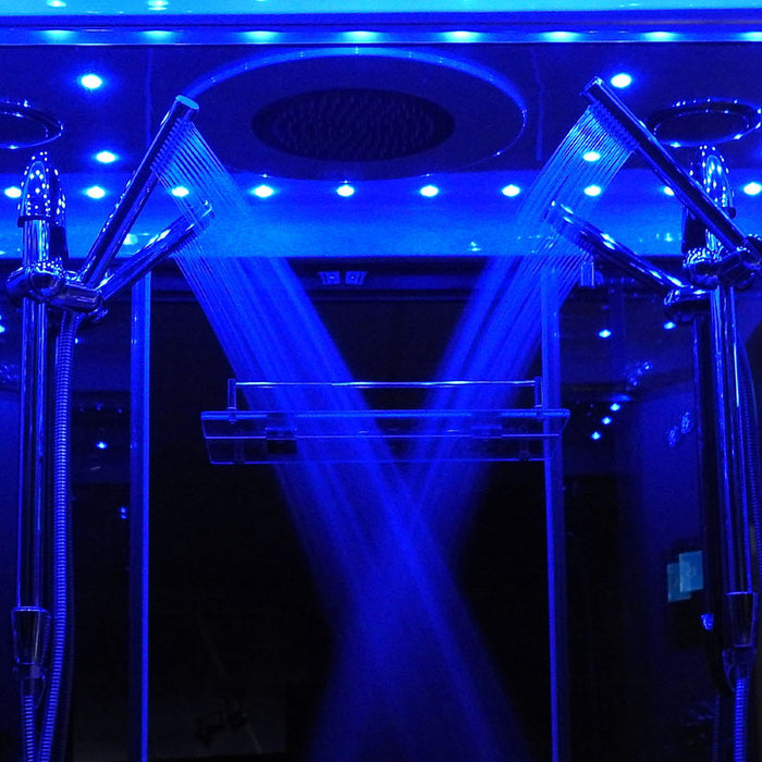 Twin hand shower system illuminated by calming LED lights inside the Insignia 1400 x 900 Rectangle Steam Enclosure.