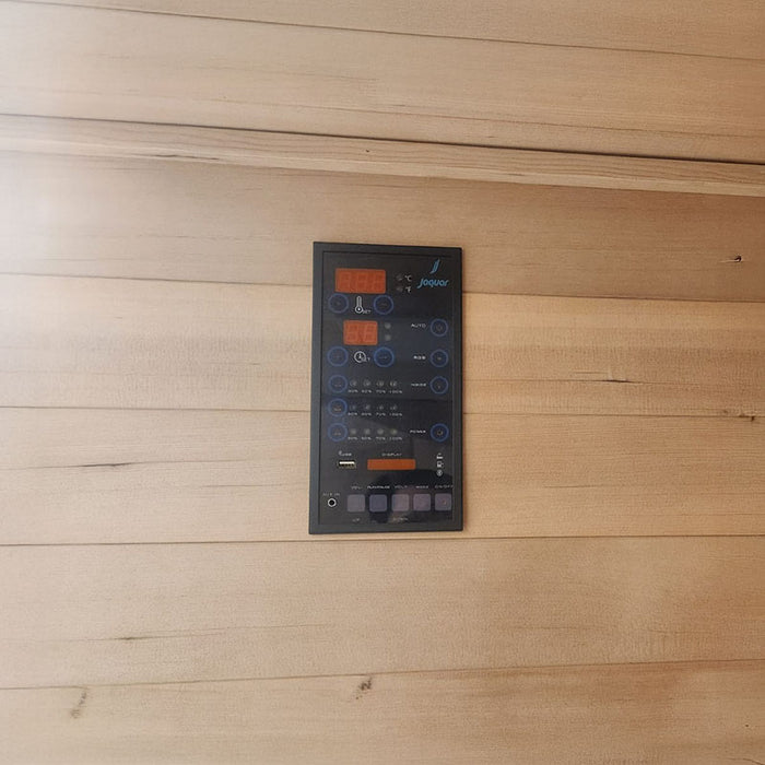 Modern black digital control panel of the Jaquar infrared sauna featuring temperature settings, timer, USB, Bluetooth, and speaker controls.