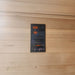 Modern black digital control panel of the Jaquar infrared sauna featuring temperature settings, timer, USB, Bluetooth, and speaker controls.