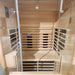 Spacious interior of the Jaquar Paire sauna for two users, with full-length heating panels lining the sides and back wall.