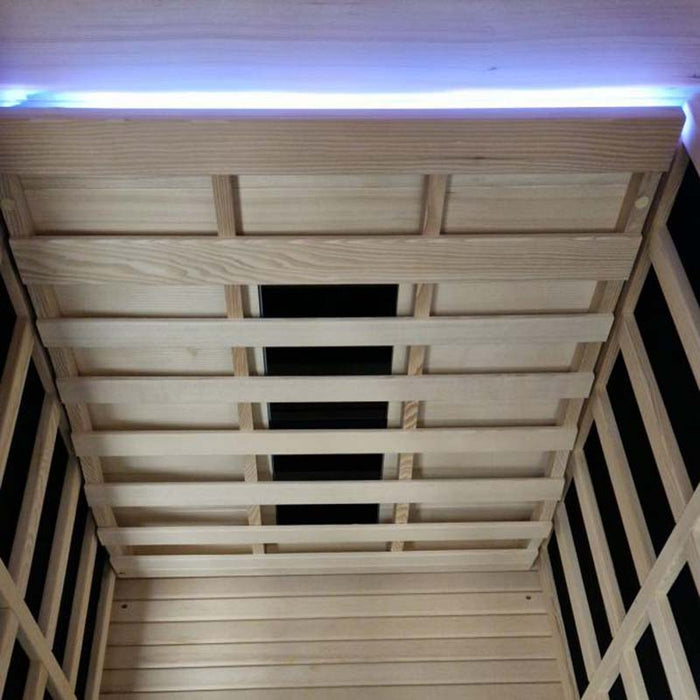 Wooden panelled ceiling with integrated LED mood lighting for a soothing sauna experience.
