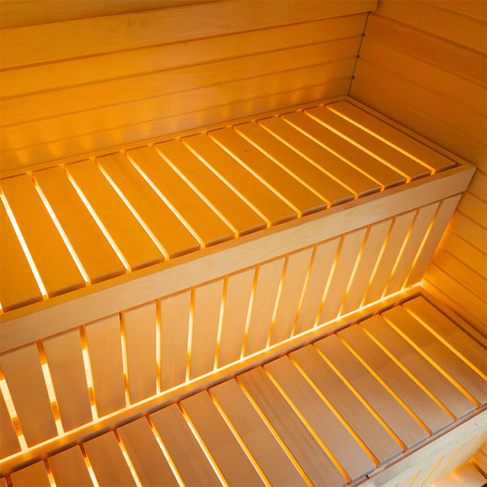 Close-up interior detail of the Jonas Classic outdoor sauna showing two-tier wooden seating and integrated lighting.