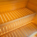 Close-up interior detail of the Jonas Classic outdoor sauna showing two-tier wooden seating and integrated lighting.