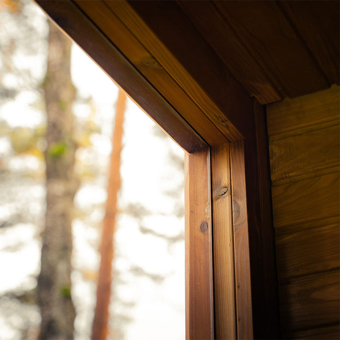 Detailed view of interior timber framing and window joinery of the Jonas Grand 8-person outdoor sauna, emphasising craftsmanship.