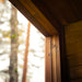 Detailed view of interior timber framing and window joinery of the Jonas Grand 8-person outdoor sauna, emphasising craftsmanship.