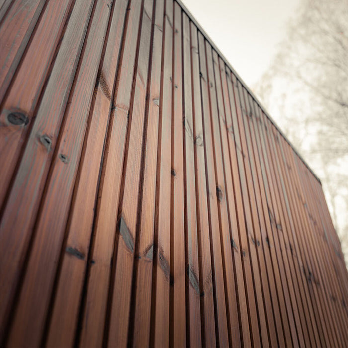 Detailed shot of the vertical wooden panel cladding on the Jonas Grand 8-person outdoor sauna, highlighting its premium exterior finish.