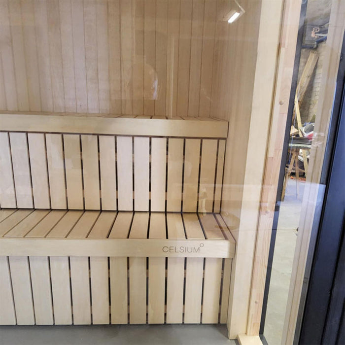Interior view of the Jonas Mini 3-person outdoor sauna with smooth, vertical slatted bench seating and high-grade timber finish.
