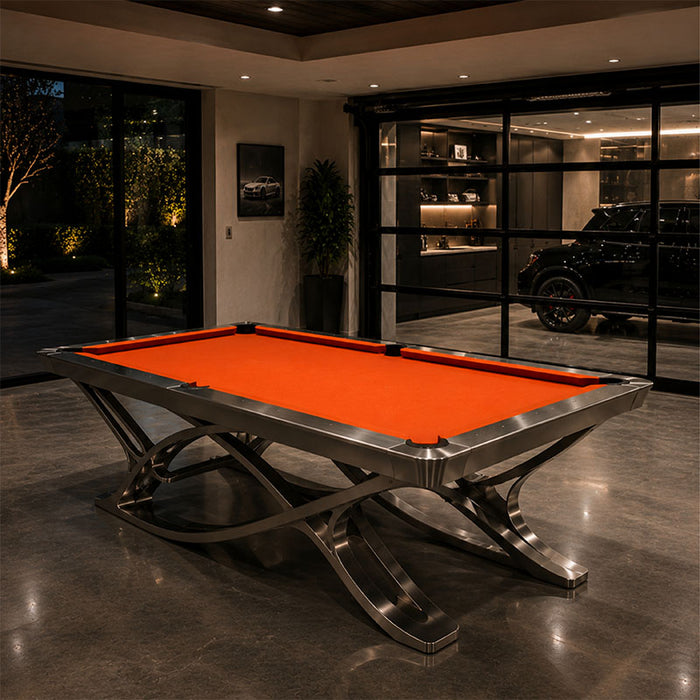 Luxury Koralturk Aristo billiards table with orange cloth and sculptural metallic legs in a contemporary interior.