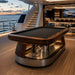 Koralturk Atlantis Gyroscopic Pool Table with premium timber finish positioned on a luxury yacht deck beside the lounge.