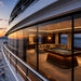 Koralturk Atlantis Gyroscopic Pool Table displayed inside an elegant glass-fronted superyacht lounge with panoramic sea views.
