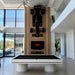 Koralturk Elit luxury billiards table with black cloth, white fluted pedestal legs and metallic detailing in an elegant city-view interior.