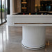 Close-up of the Koralturk Elit Pool Table with white ribbed pedestal, black cloth and refined metallic trim detailing.