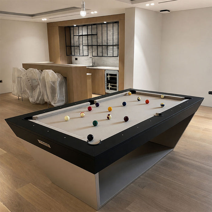 Koralturk Kaplankaya Pool Table with white cloth, angular black frame and silver base in a contemporary home games area.