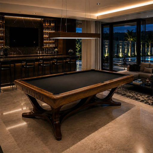 Koralturk Legnora billiards table with black cloth and sculptural timber base in a luxurious modern entertainment room.