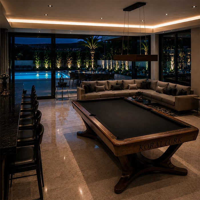 Koralturk Legnora luxury pool table with black cloth and elegant wooden frame in a sophisticated poolside living room.