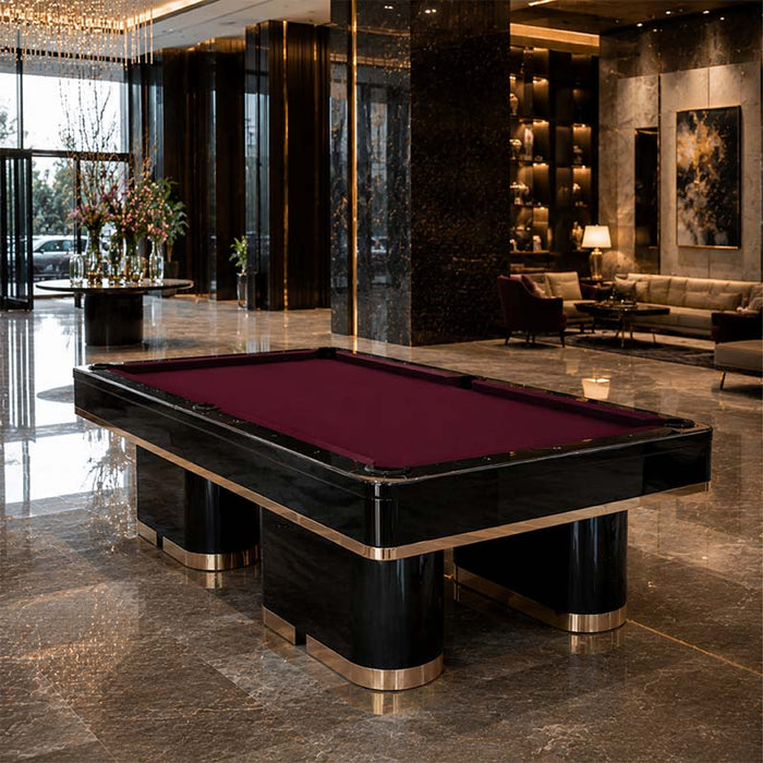 Angled view of the Koralturk Trapeza luxury pool table with purple playing cloth, black finish and distinctive gold trim.