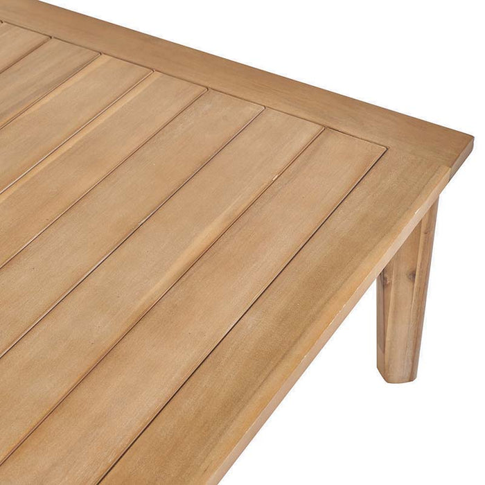 Detailed view of the Larissa Outdoor Corner Seating Set's coffee table top, showing the smooth wooden slats and seamless finish.