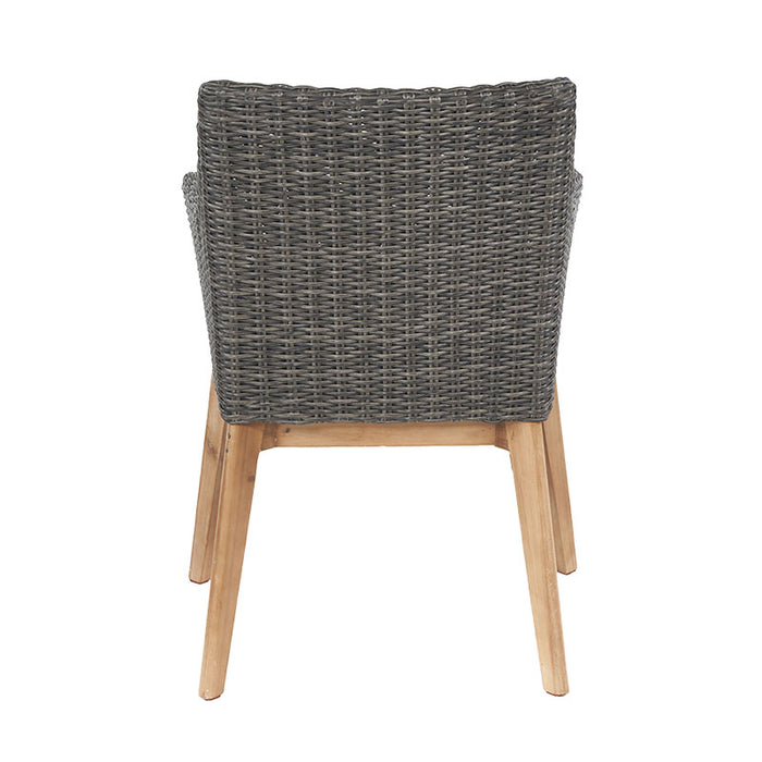 Back view of a Larissa Outdoor Dining Set chair, showcasing the woven rattan design and sturdy acacia wood legs.