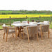 An angled image showing the entire Luna dining set, featuring the concrete table and rope chairs, arranged for outdoor dining.