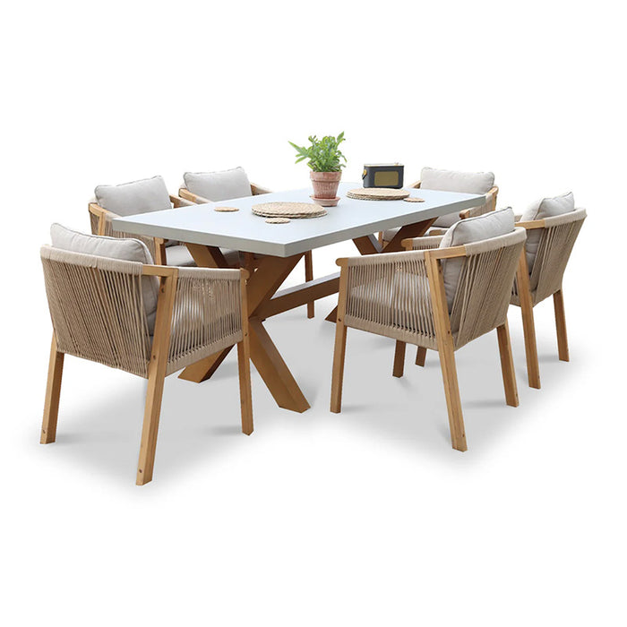 A side-angle image of the Luna Dining Set with its solid wood legs and rope dining chairs.