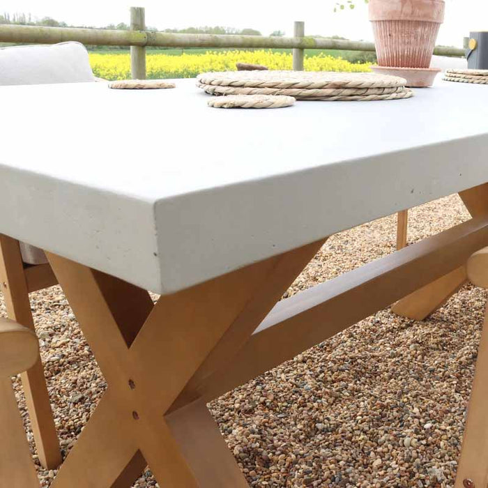 A detailed view of the concrete table's edge, showcasing the sturdy build and smooth finish of the Luna 6 Seater Set.