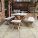 Close-up of Luna Dining Table showcasing the concrete top and wooden legs in a modern outdoor space.