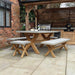 Luna outdoor dining set with spacious concrete table and sturdy wooden benches under a pergola.