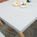 Close-up of Luna dining table's concrete surface, perfect for modern outdoor dining setups.