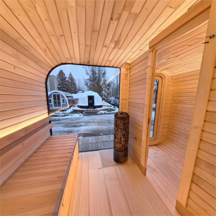 Interior view of Luna Outdoor Sauna including wooden benches and heater. 