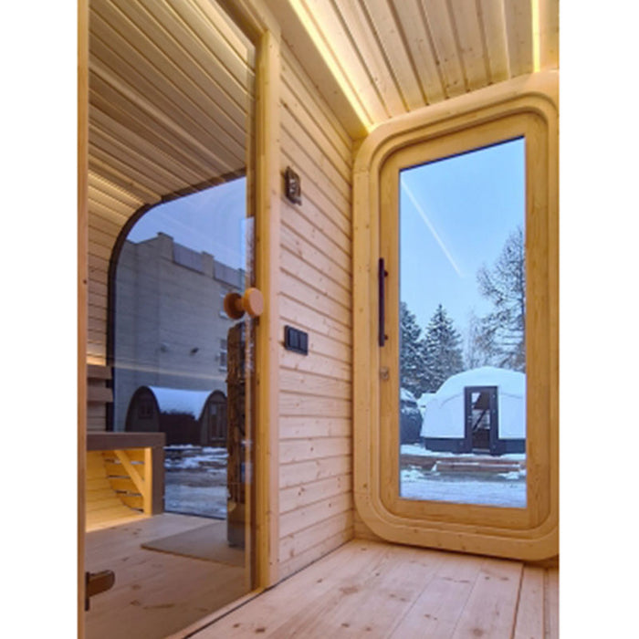 Wooden changing room of Luna Outdoor Sauna showing internal and external glass door.