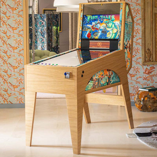 Maison Roshi Jiraiya Pinball Machine in living room with Fish Tales themed backglass, wooden body, and patterned side trim.