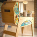 Close-up rear side panel of Maison Roshi Jiraiya Pinball Machine with vibrant turquoise and orange patterned artwork and wooden cabinet.